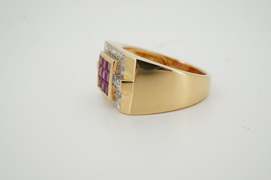 A modern 18k, ruby and diamond set square cluster dress ring, size R/S, gross weight 8.1 grams. Condition - good